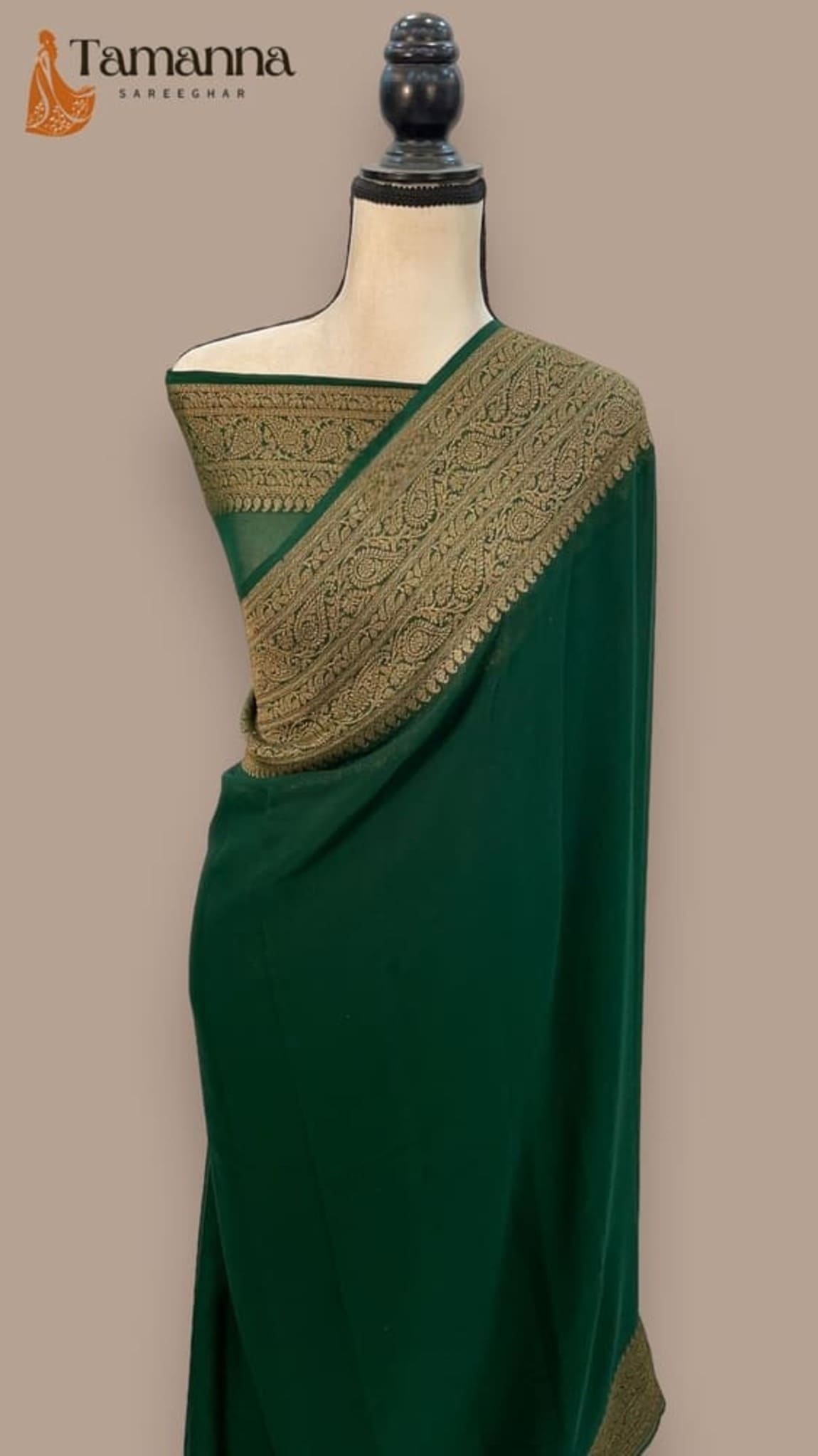 Green saree with antique zari gold pallu border and textured zari motifs, draped on mannequin
