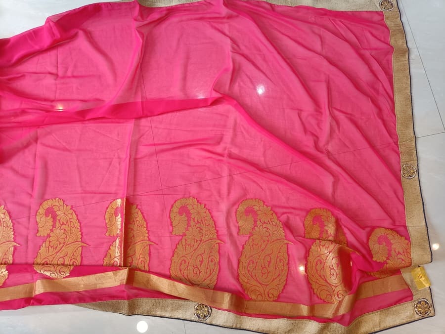 Hot pink chiffon saree with gold paisley-pattern border and beige edging