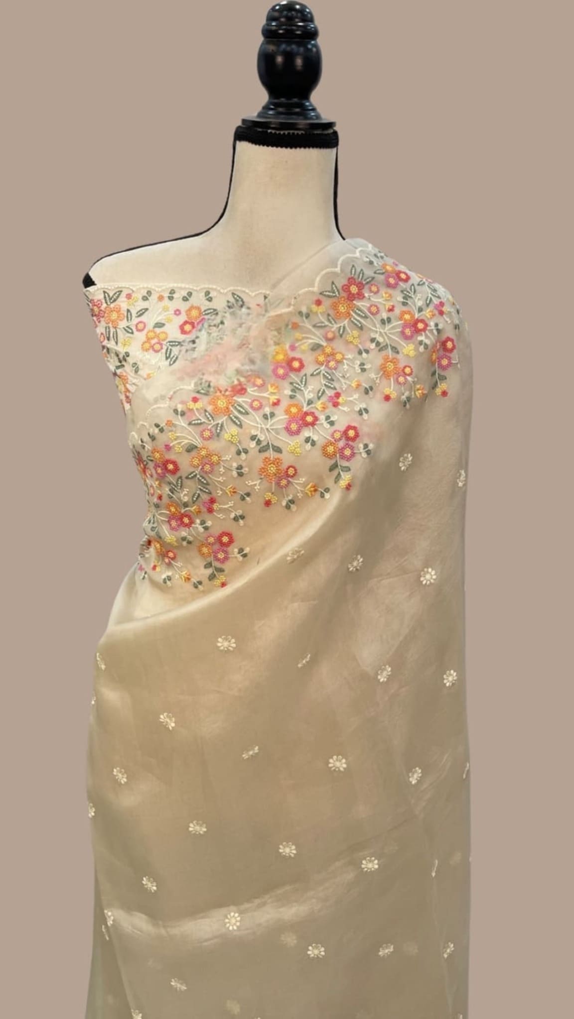 Ivory organza saree with small floral chikankari sprigs and dotted motifs