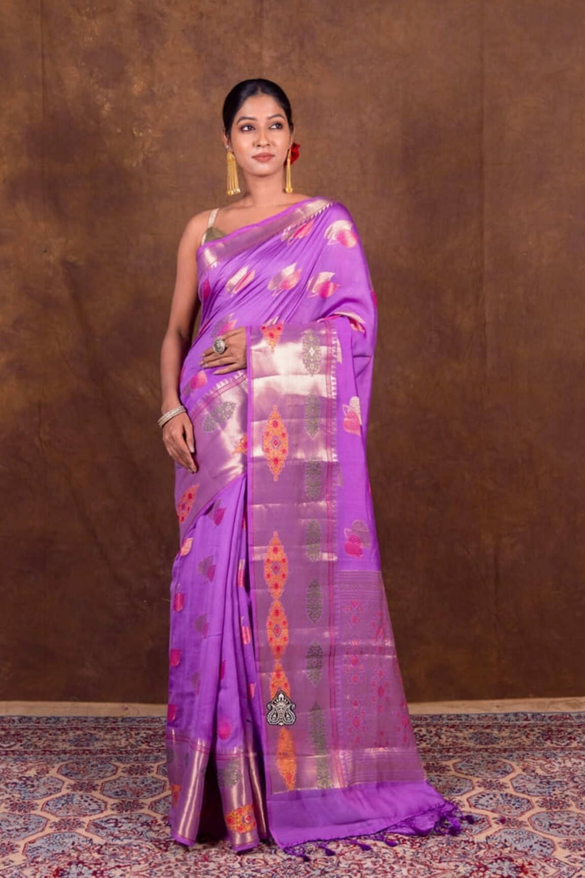 Lavender banarasi saree with gold border and hanging motifs, long drape
