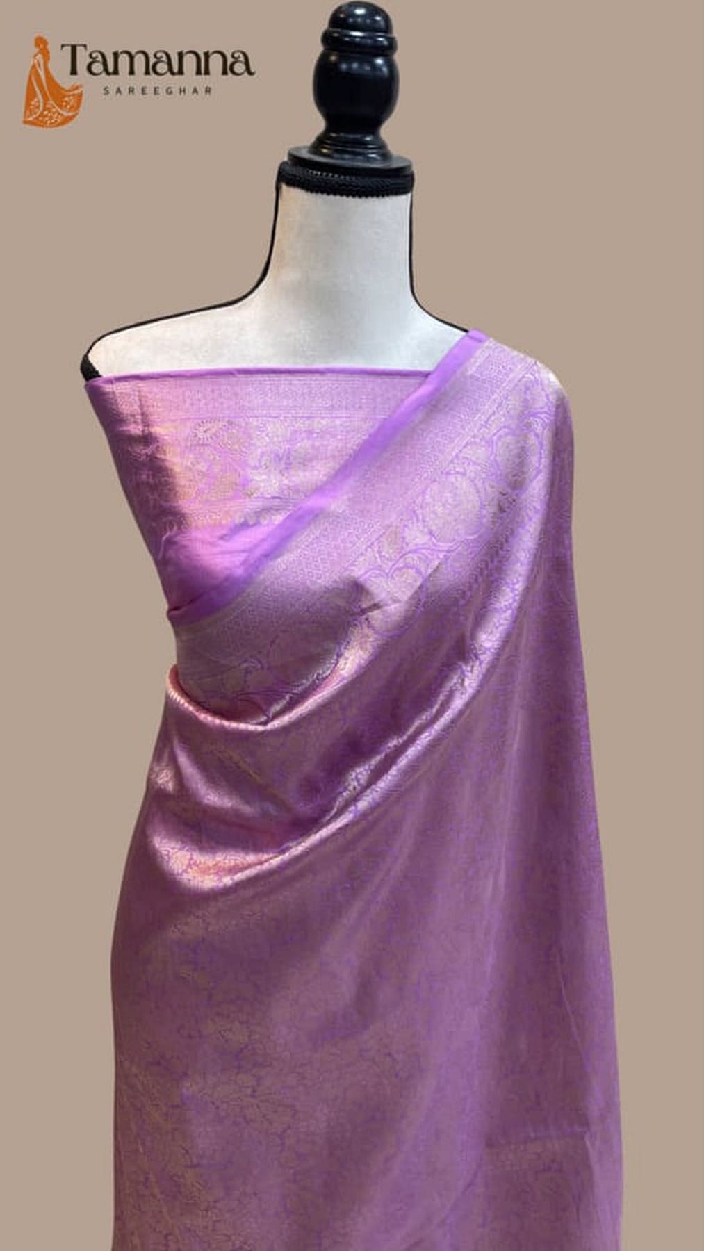 Lavender silk saree with purple zari border and woven brocade drape on mannequin