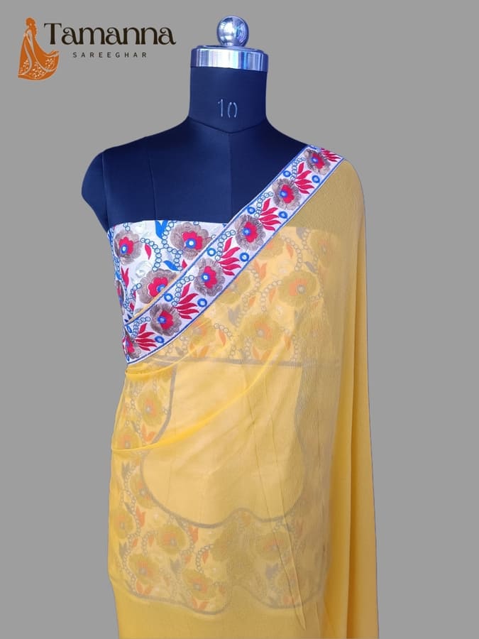 Light yellow chiffon saree with floral border pallu and blue blouse
