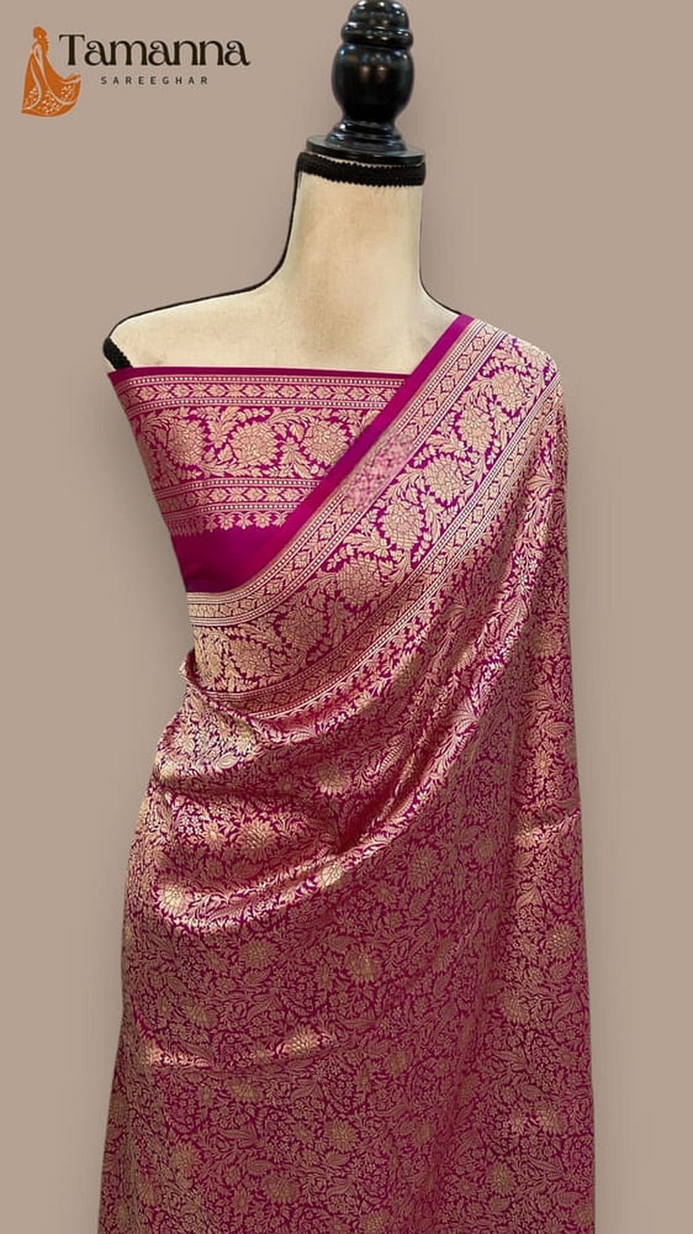 Mauve silk saree with gold zari border, pallu over shoulder on mannequin