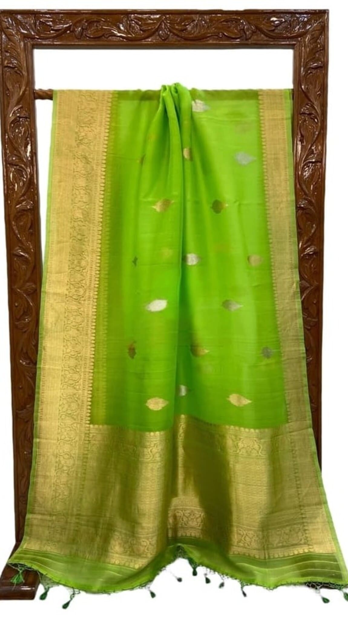 Parrot green saree with gold panel border and scattered leaf motifs