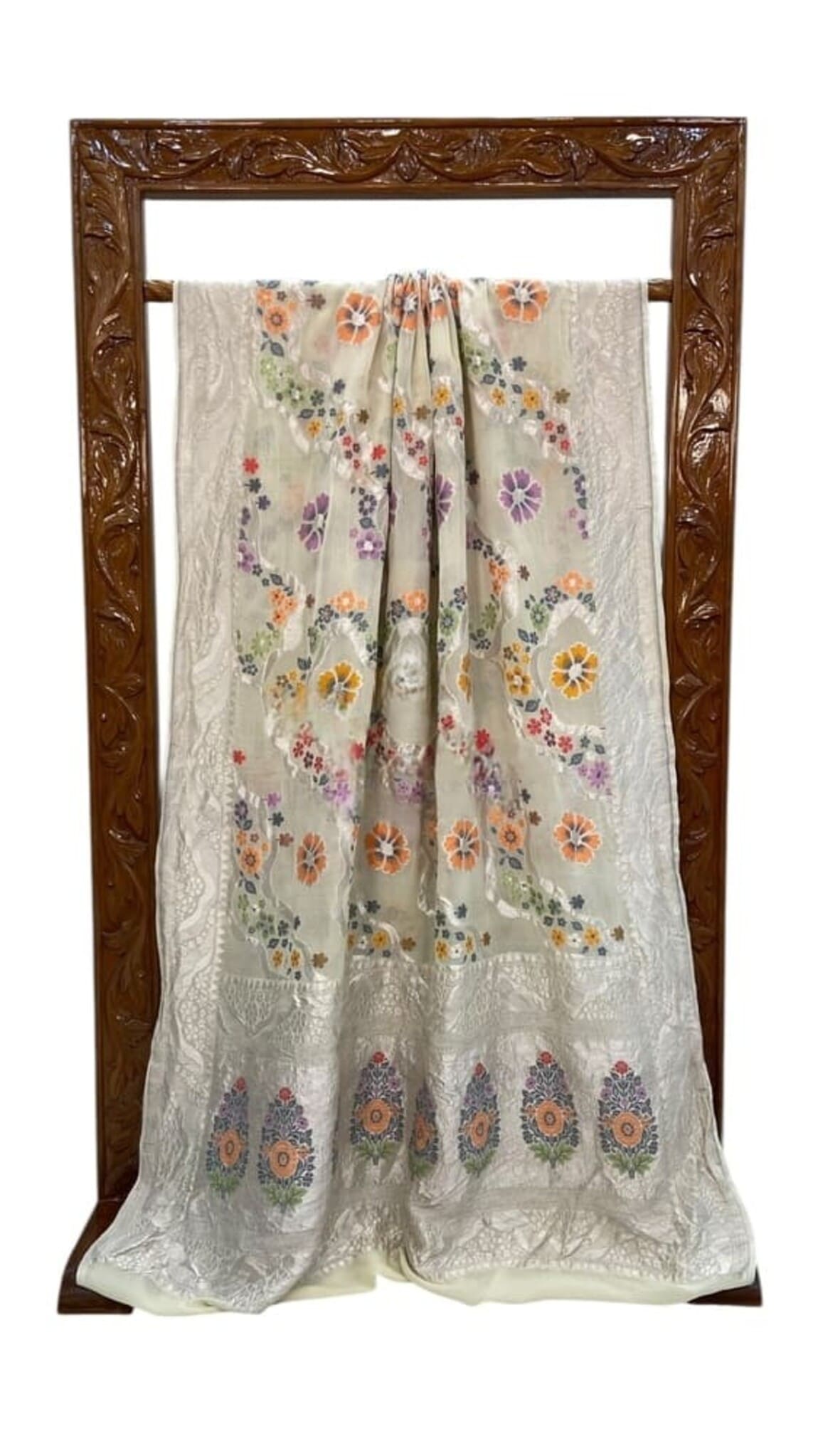 White saree with purple and orange flower motifs, shown front view