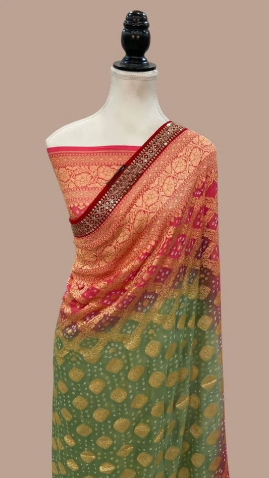 Draped pink, green, and gold saree with dark border and allover motif weave