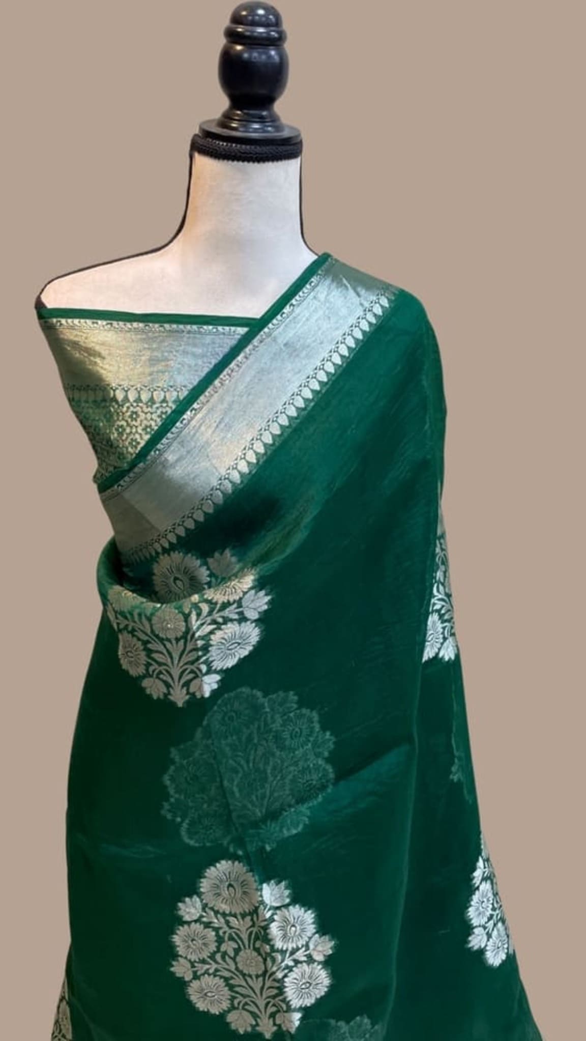 Dark green Banarasi saree with off-white floral motifs and metallic border