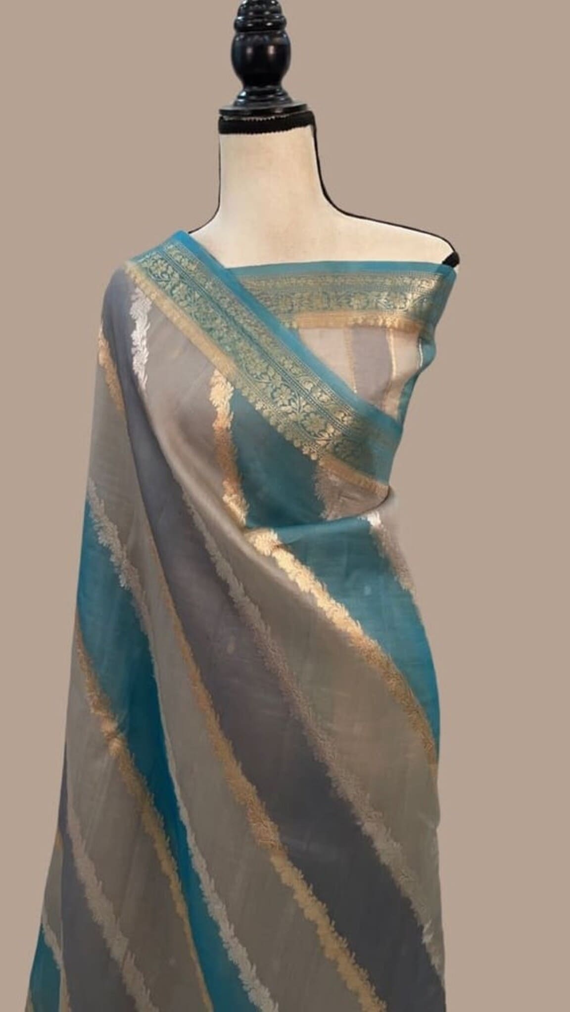 Turquoise and grey Banarasi saree with gold zari stripes across body and border