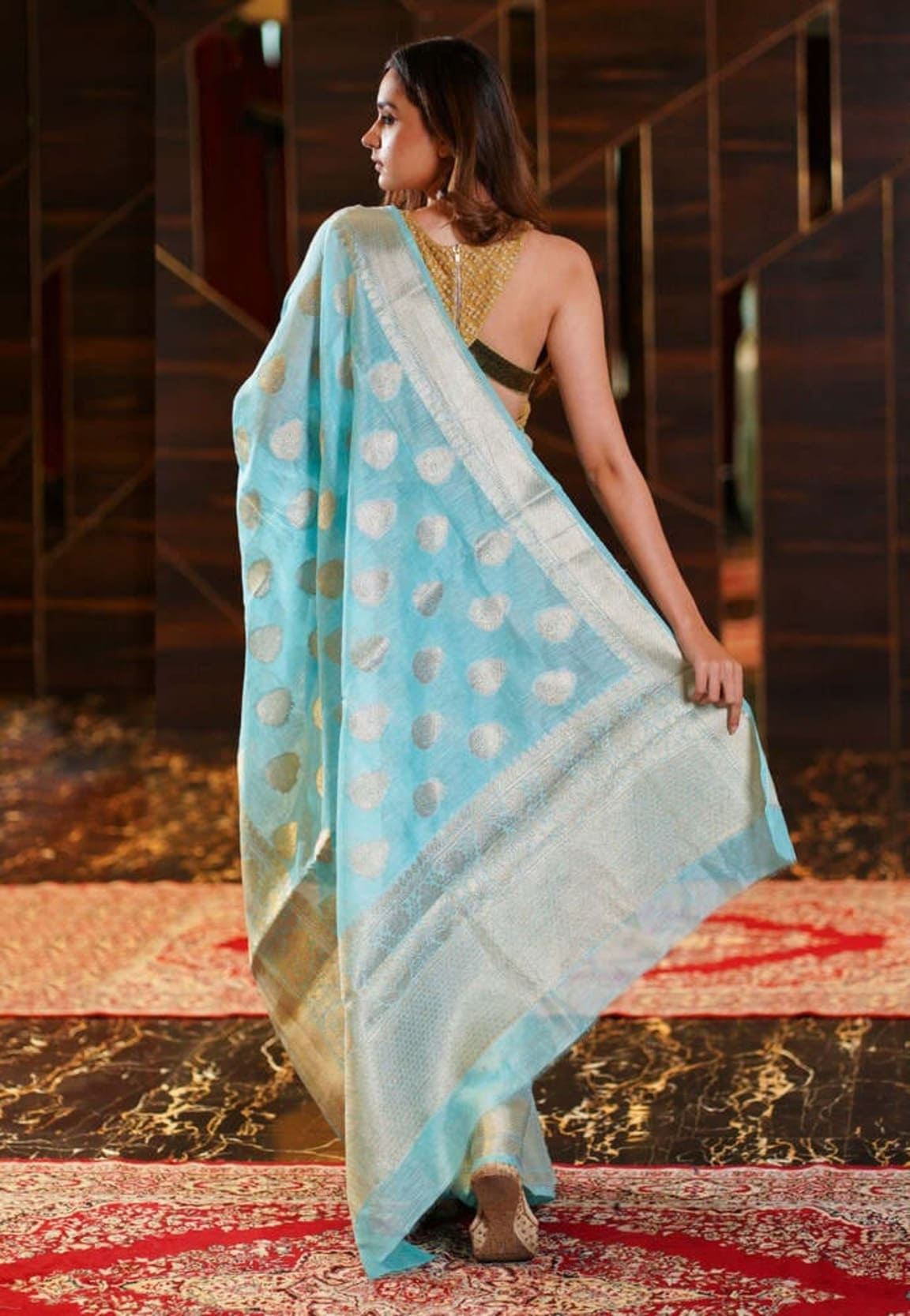 Aqua blue pure linen saree with gold dot motifs and wide silver zari border
