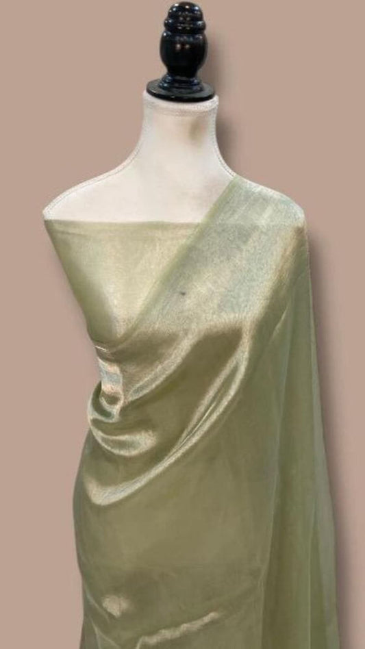 Light green saree with gold-tone sheen drape over mannequin, plain woven texture