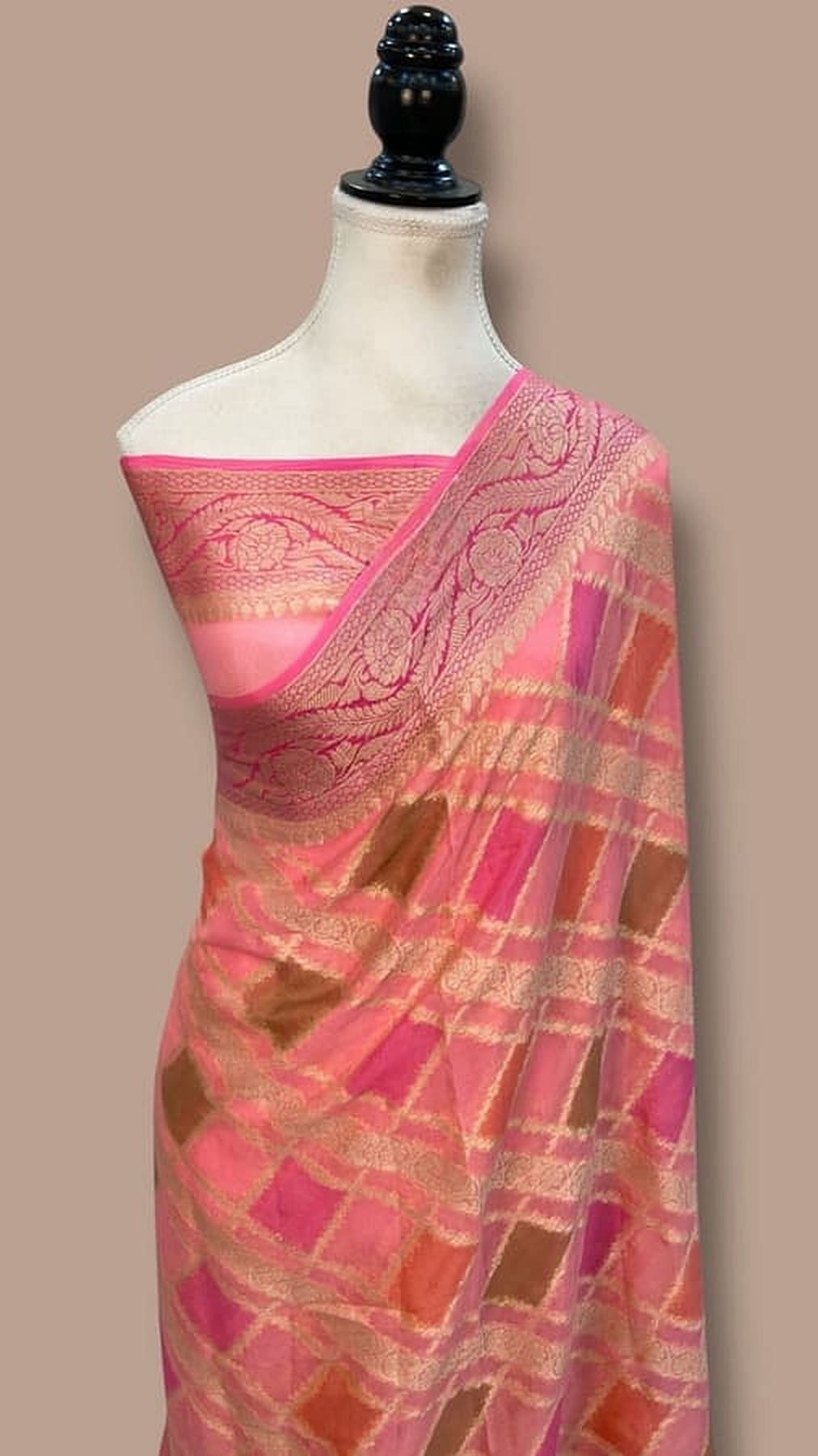 Banarasi chiffon saree in baby pink with magenta border and gold-toned woven motifs