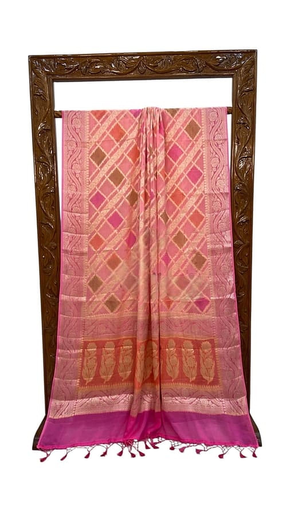 Baby pink Banarasi saree with magenta border and woven lattice design, laid flat