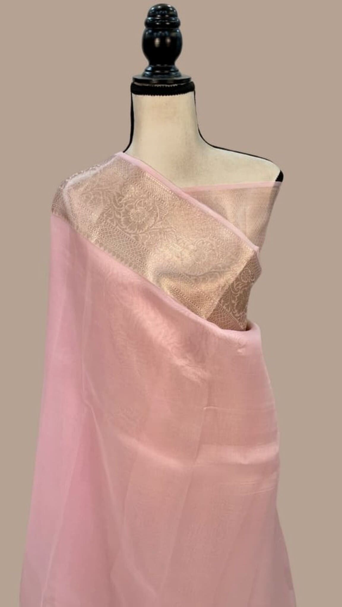 Baby pink Banarasi kora handloom saree with gold-toned border on mannequin