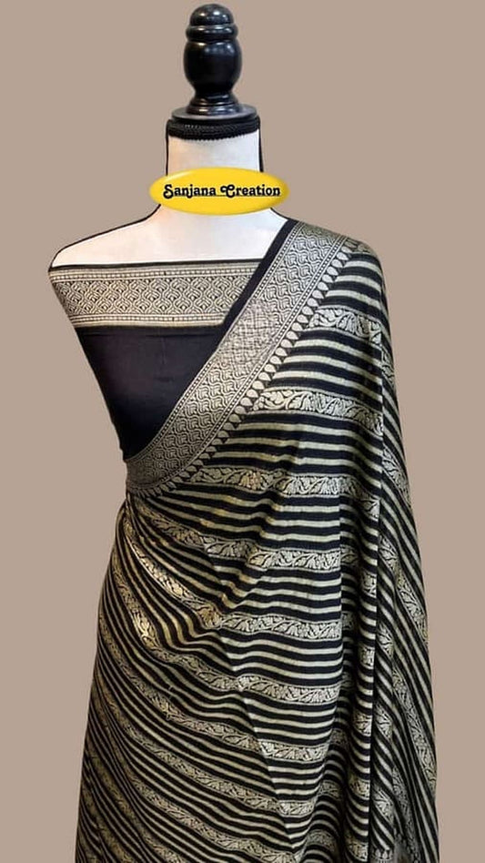 Draped black chiffon saree with striped pallu border and gold woven accents