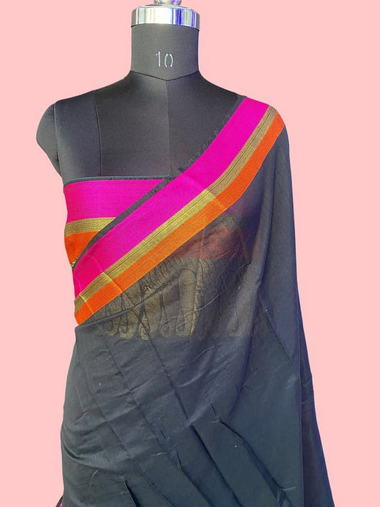 Dark blue silk saree worn on drape with magenta diagonal border and gold orange stripes