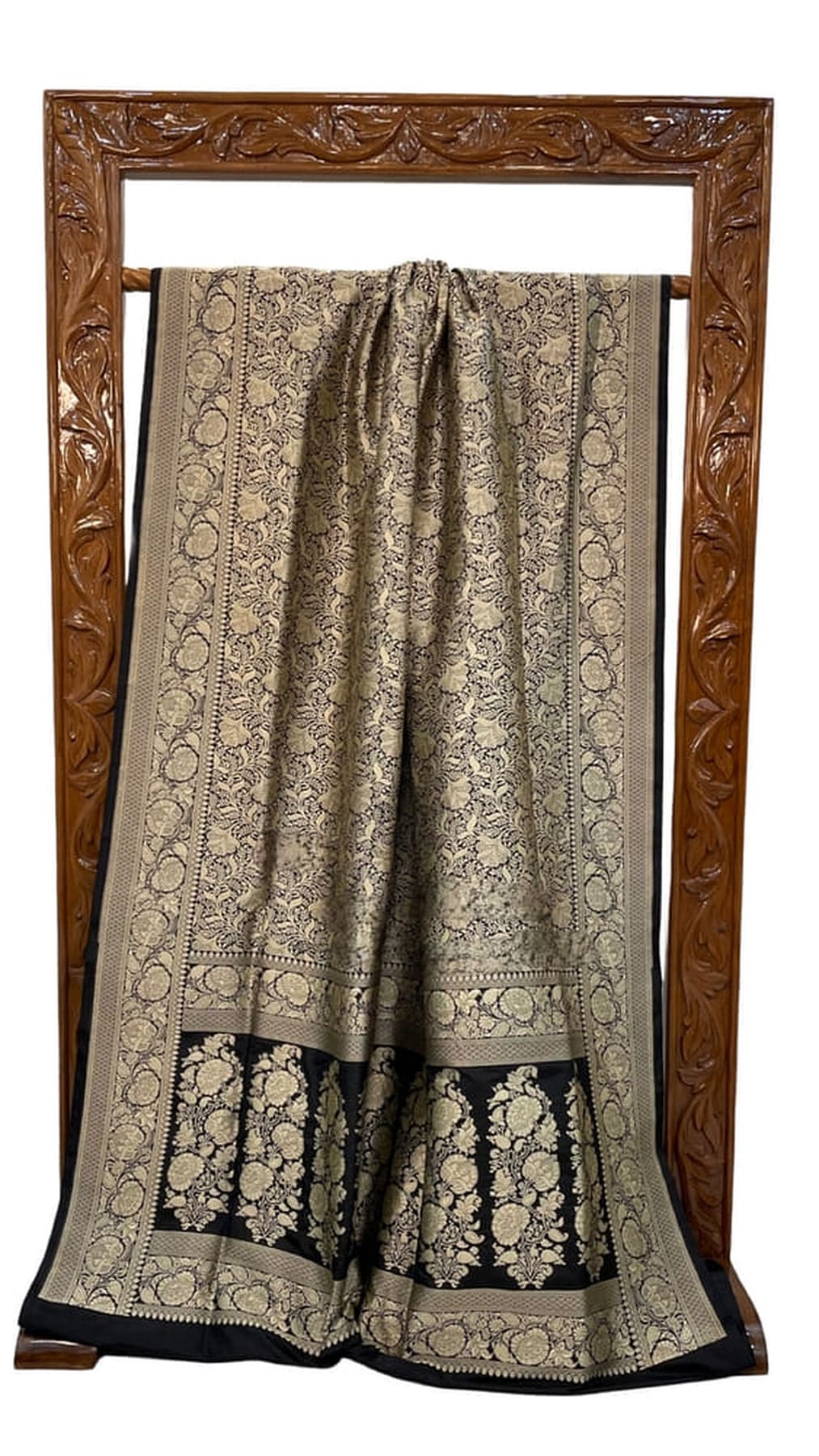 Banarasi silk saree laid flat, cream brocade center and dark bottom border