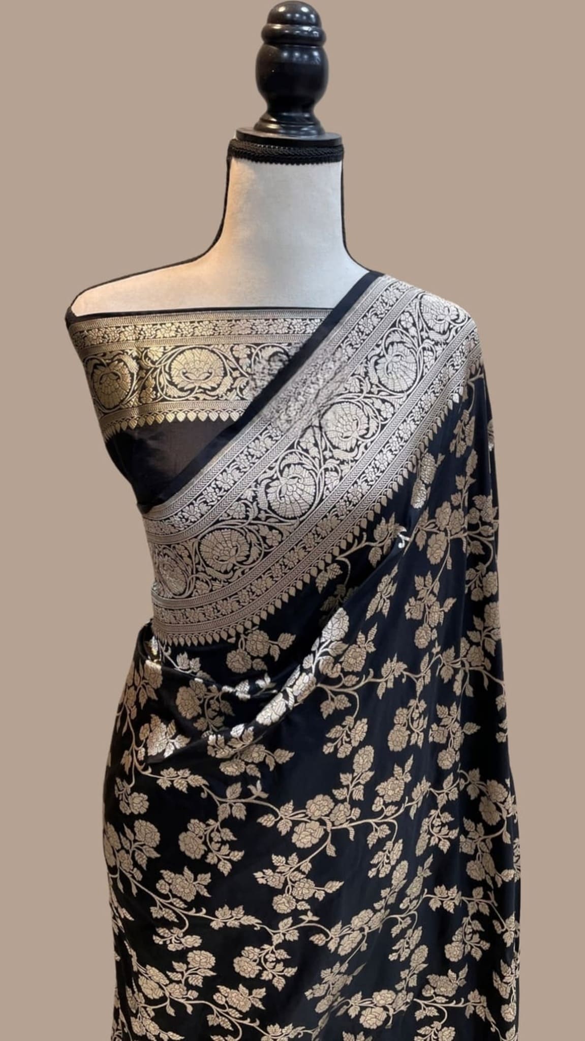 Black silk Banarasi saree with floral vine motifs and ornate silver-gold zari border