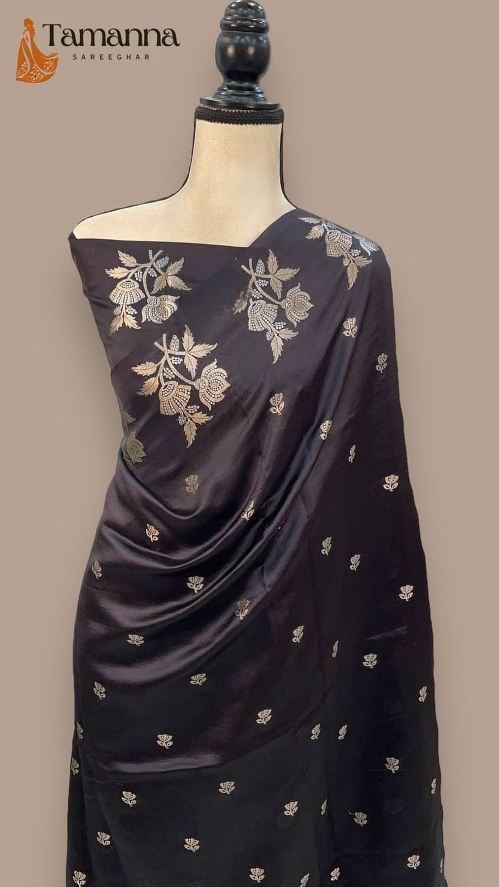 Pure silk Banarasi handloom saree with gold floral sprig motifs, draped on mannequin