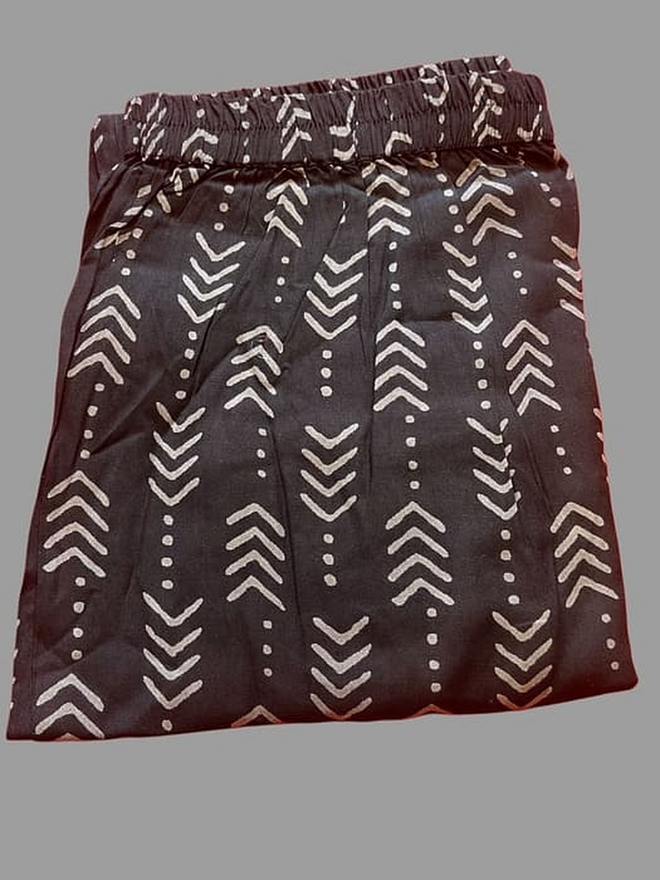 Dark maroon printed rayon bottom with repeated chevron lines and tiny button-like dots