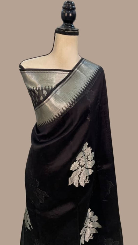 Black Banarasi saree with silver-gray border and gold floral embroidery on pallu