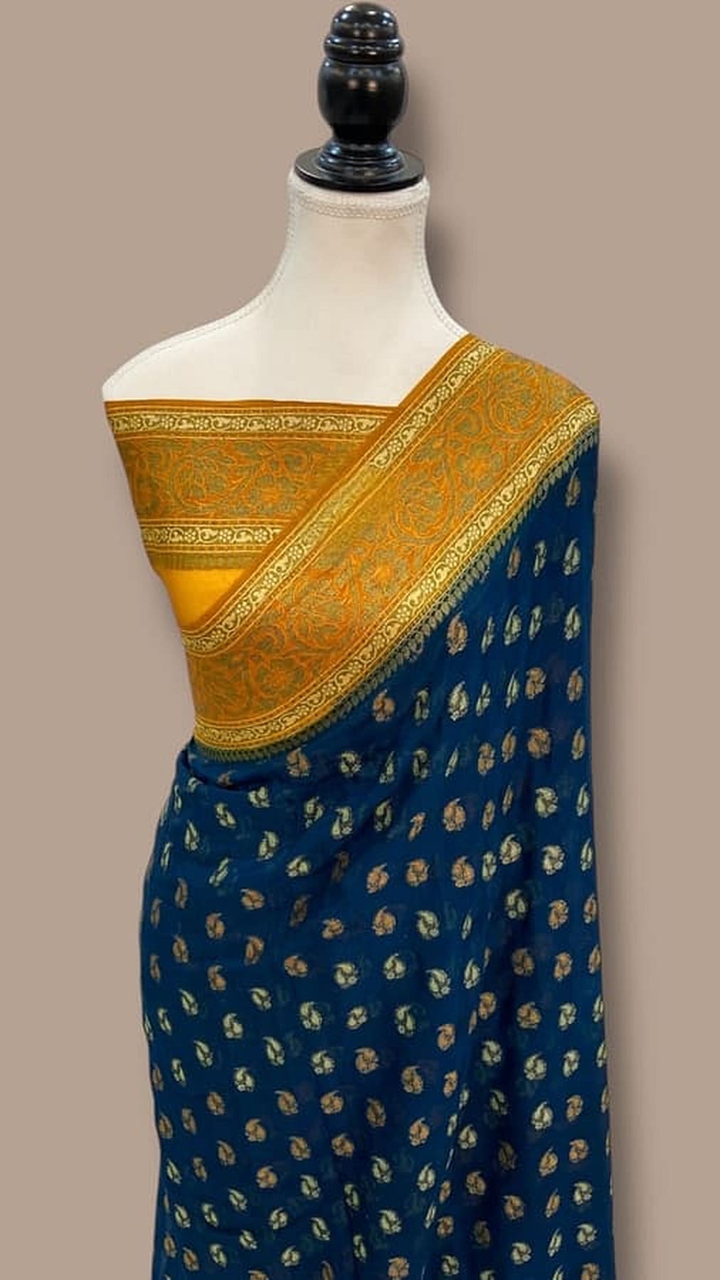 Draped Blue Banarasi chiffon saree with gold zari edging and allover small gold motif pattern