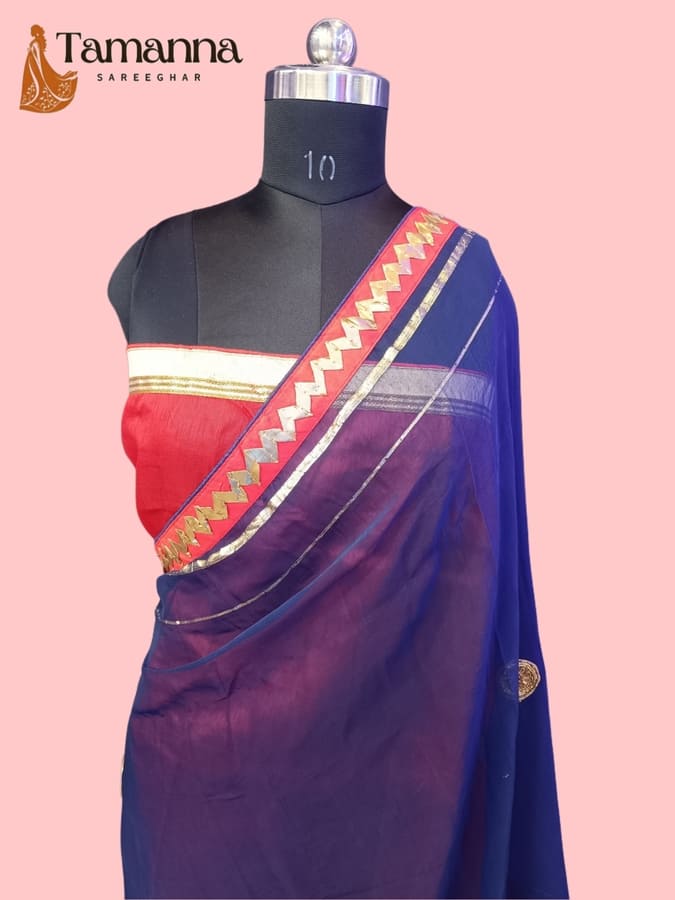 Draped chiffon saree in dark blue with maroon accent and gold trim, worn on mannequin
