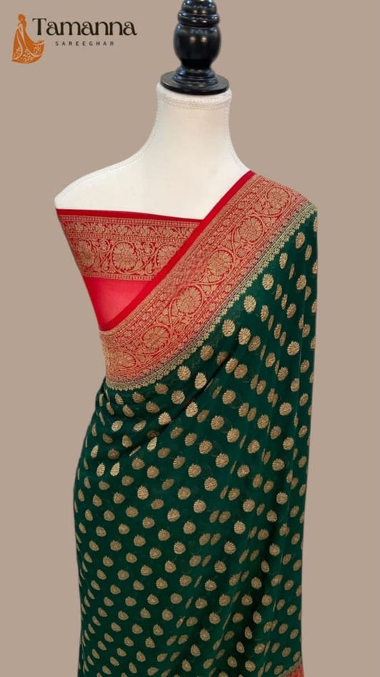 Bottle green Banarasi saree with gold leaf-like motifs and red pallu border