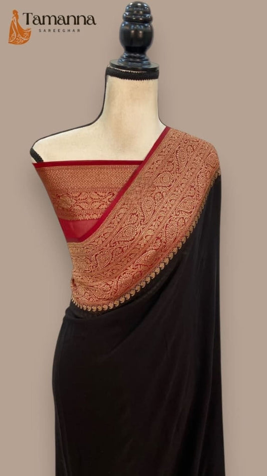 Dark saree with textured rust-gold pallu and red border strip