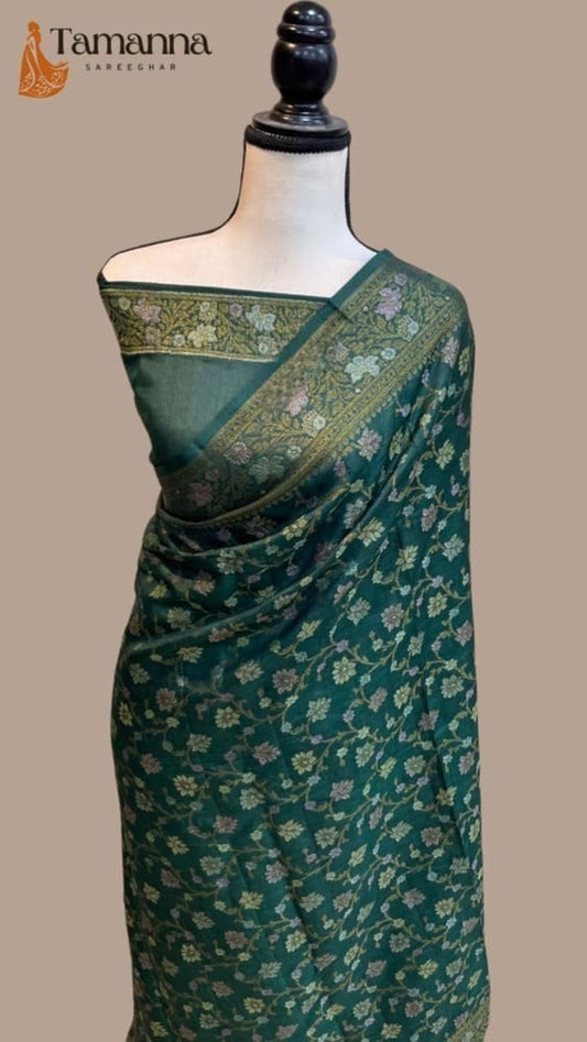 Banarasi crepe saree in bottle green, pallu with gold floral pattern and border on mannequin