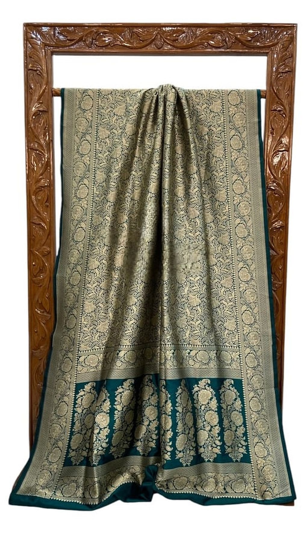 Bottle green silk saree with teal hem and circular woven brocade medallion design