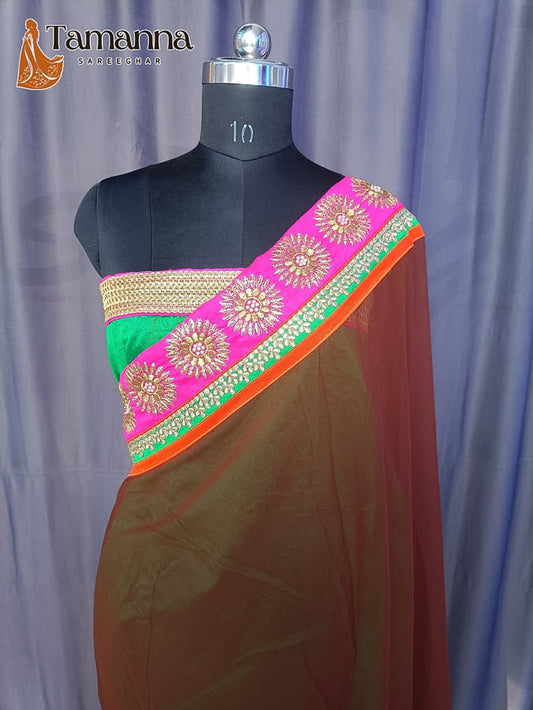 Georgette saree with brown body and orange-edged pink pallu, green stripe and gold zari