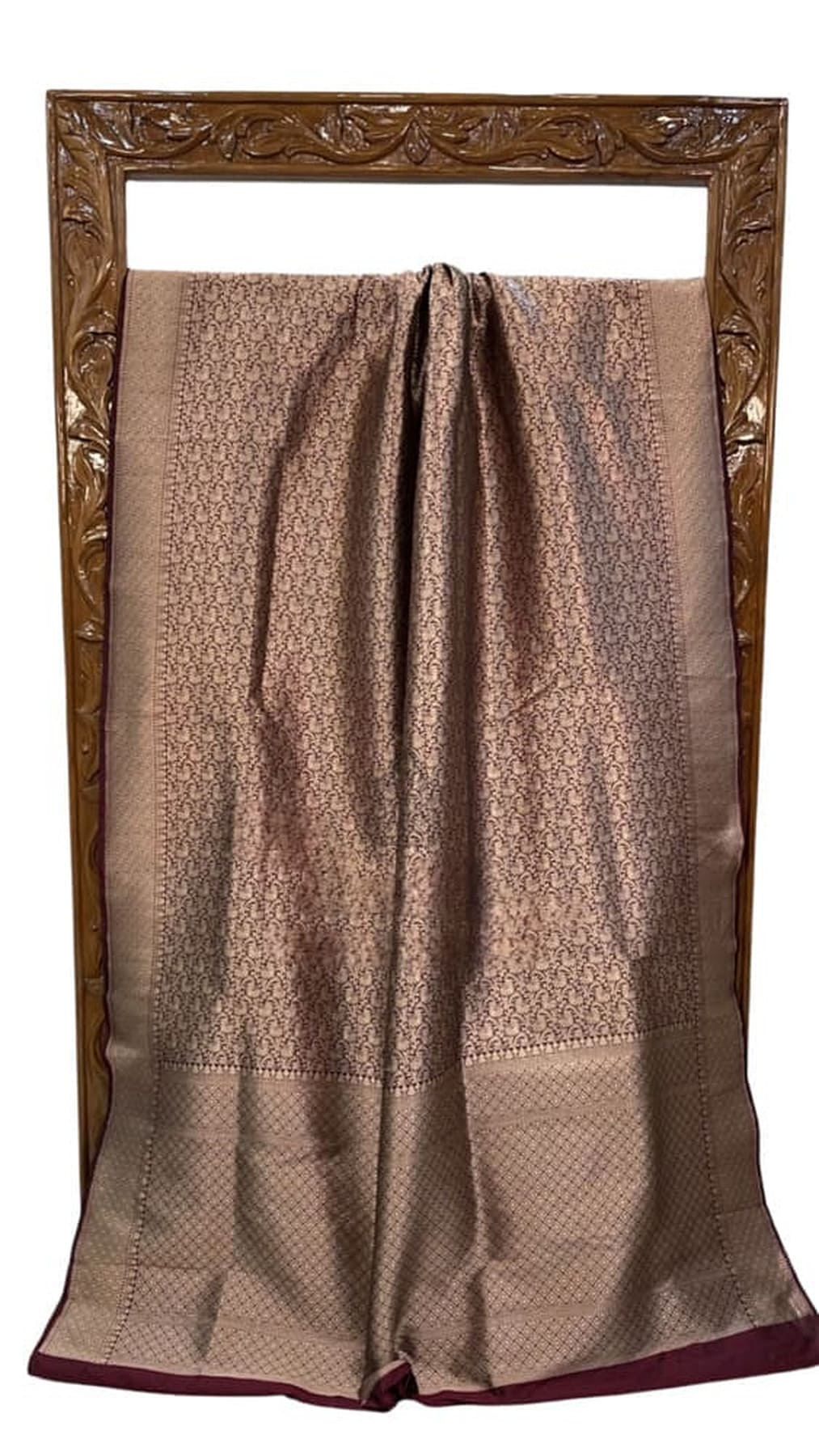 Brown Banarasi silk saree laid flat with gold check motif border and maroon end