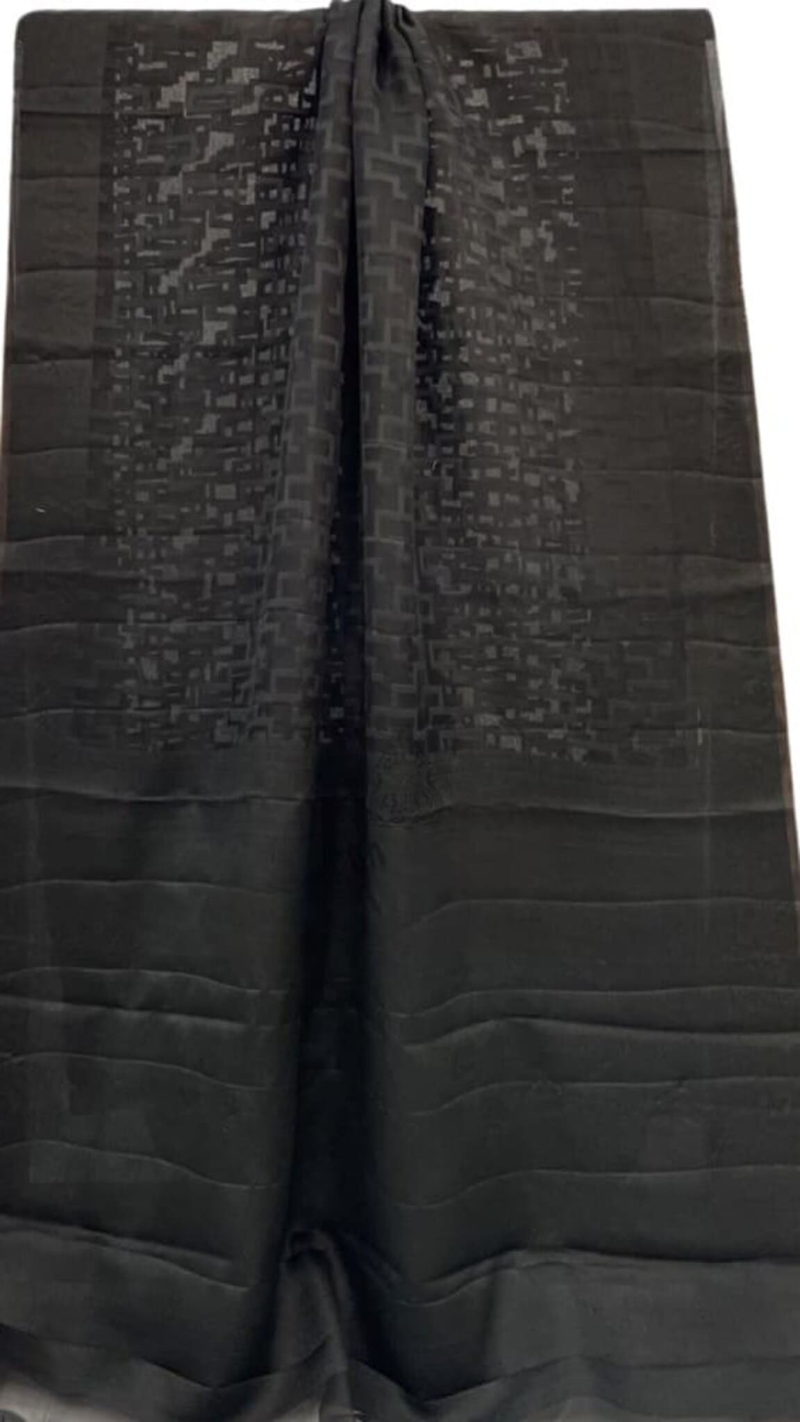 Black woven saree with repeating motif body and solid border, folded view