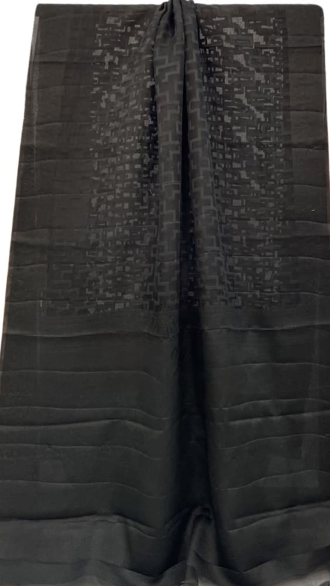 Black woven saree with textured motif pattern and wide solid border, folded