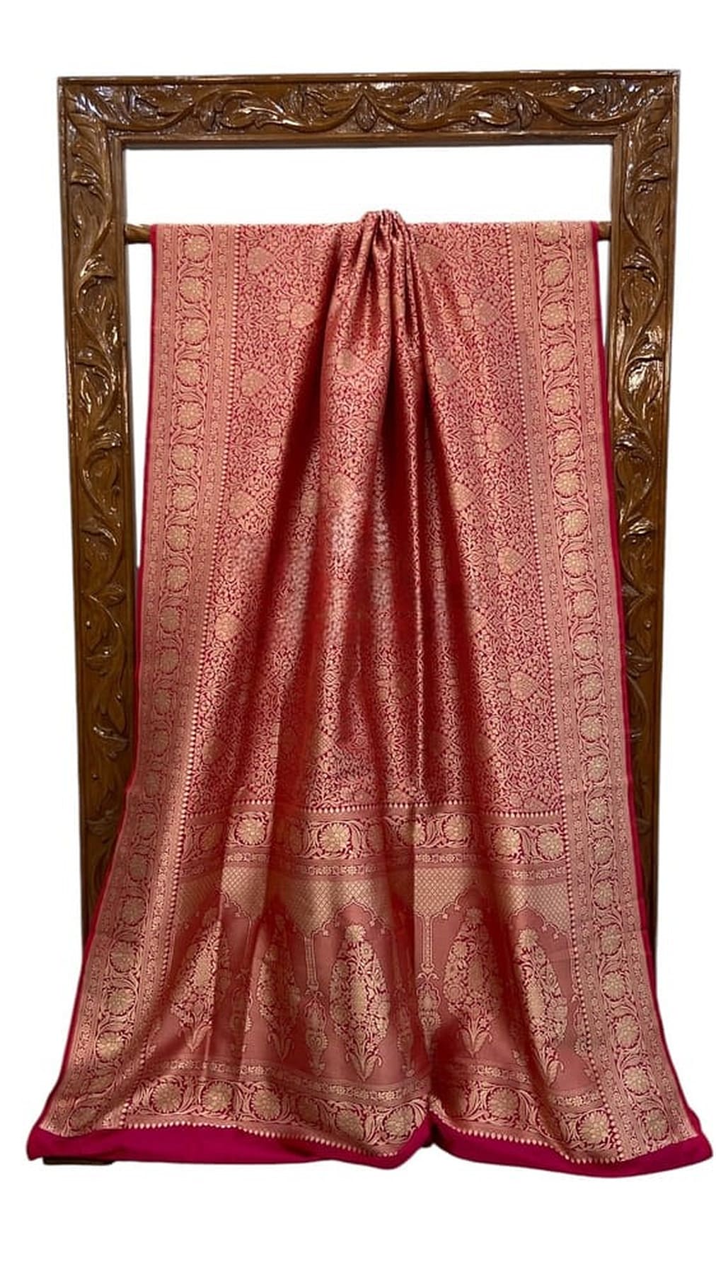 Cherry red silk Banarasi saree with gold-toned woven motifs and contrast pallu border