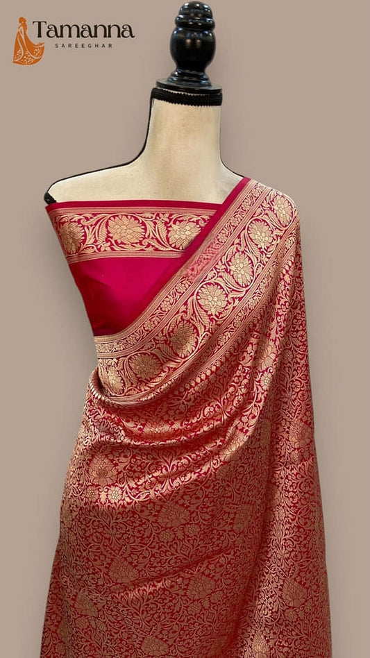 Cherry red silk Banarasi saree with gold-toned brocade border and textured pallu detail