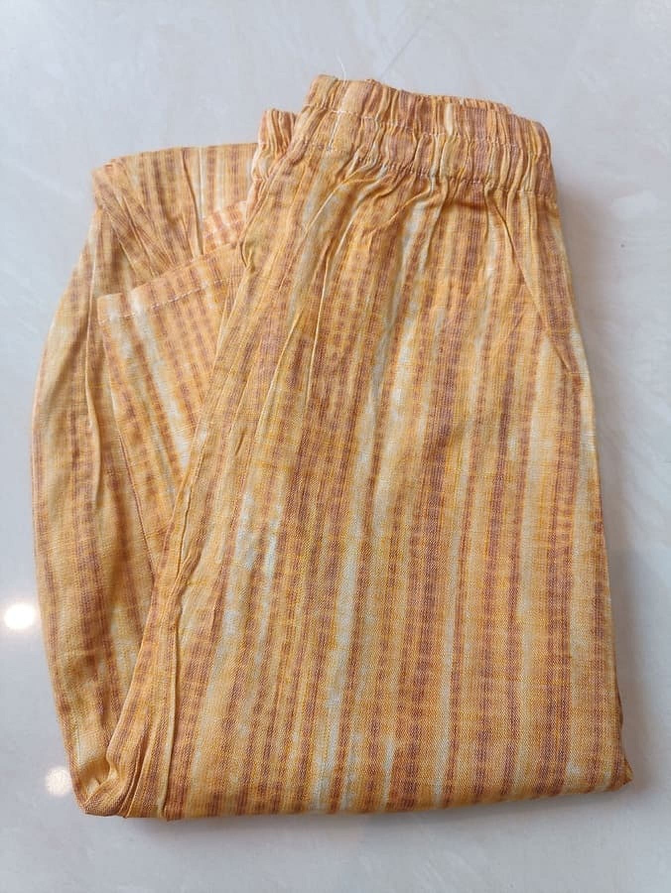 Tan and gold cotton striped pajama trousers with elastic waist and relaxed straight legs