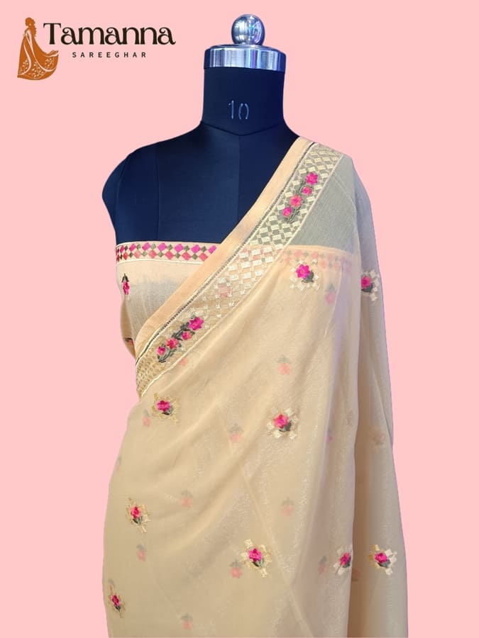 Cream chiffon saree with resham floral embroidery and border, side drape on mannequin