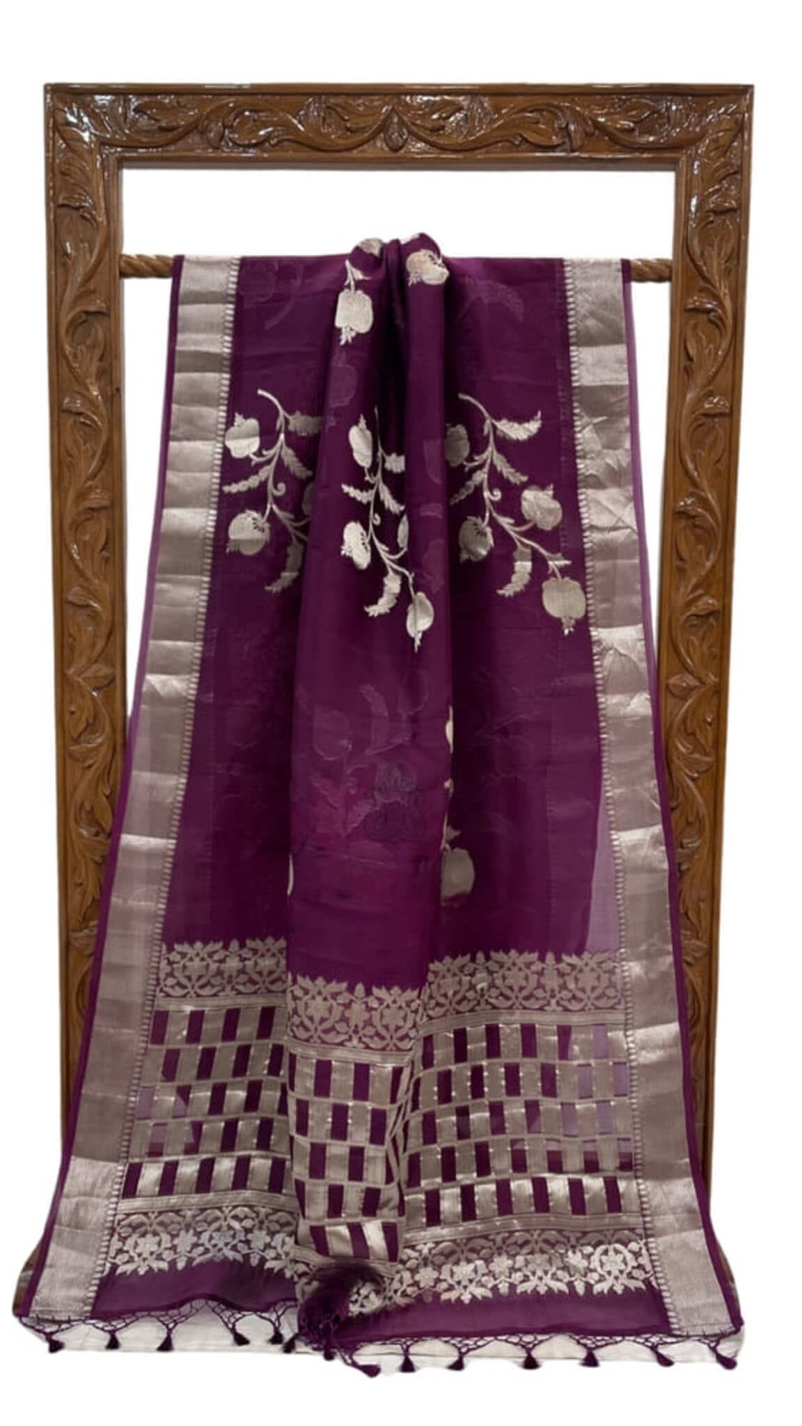 Dark purple Banarasi saree with silver zari border, floral vines and checked hem
