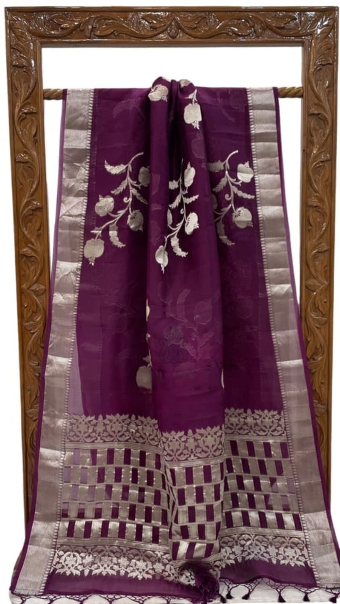 Dark purple Banarasi silk saree with silver borders, floral pattern and checked hem