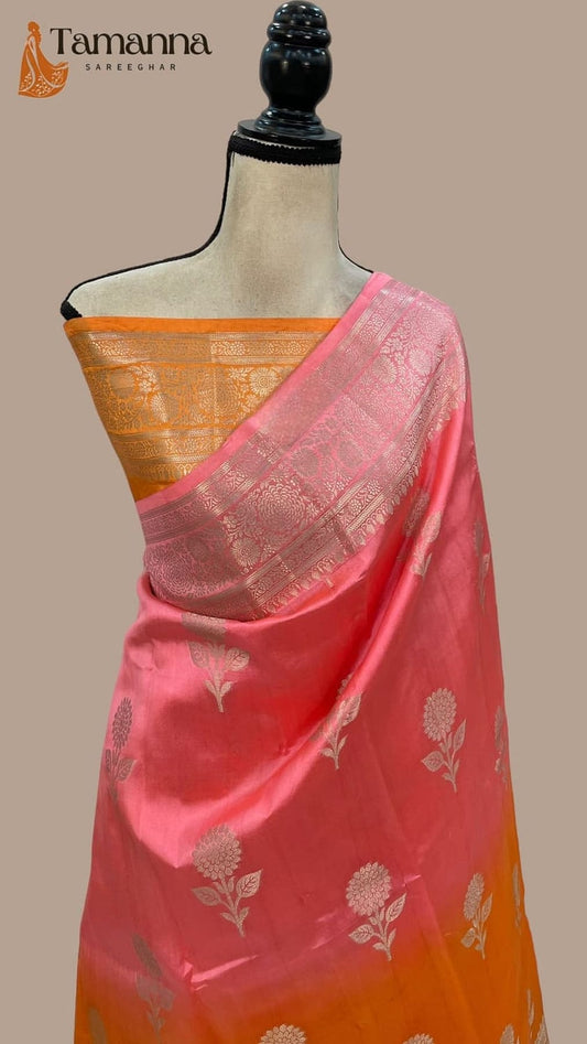 Dual-shade silk saree on mannequin: pink and orange drape with gold border, woven motifs