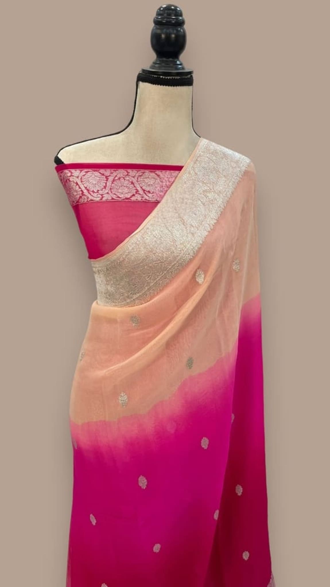 Khaddi georgette Banarasi saree on mannequin, magenta pleats with peach pallu and gold sheen