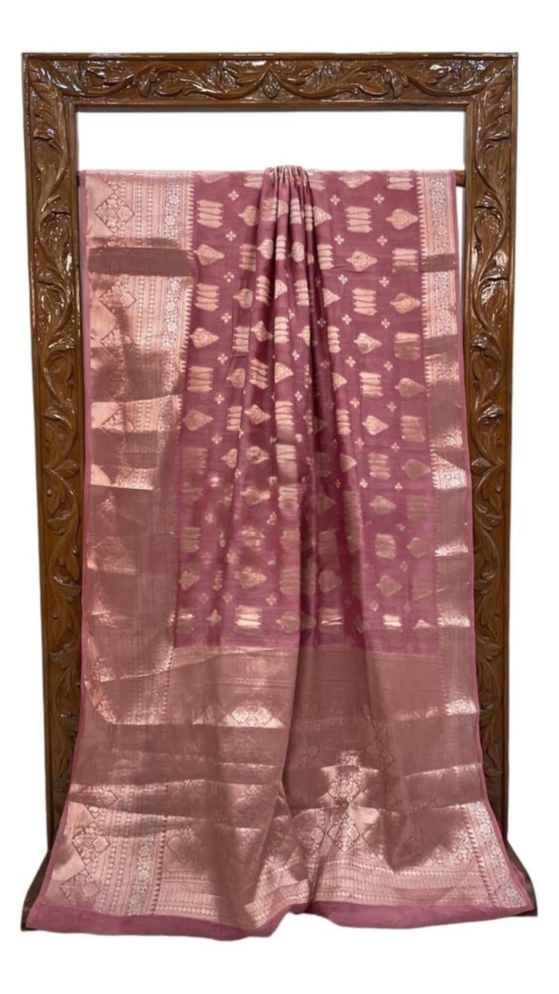 Dusty pink cotton saree, folded view with gold-toned motifs and ornate border on edges