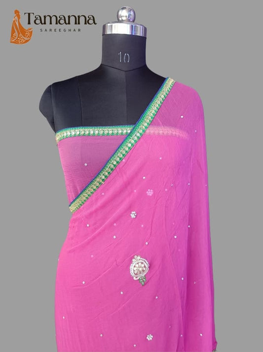 Pink chiffon saree with pearl-like bead work, green-gold border and embellished pallu