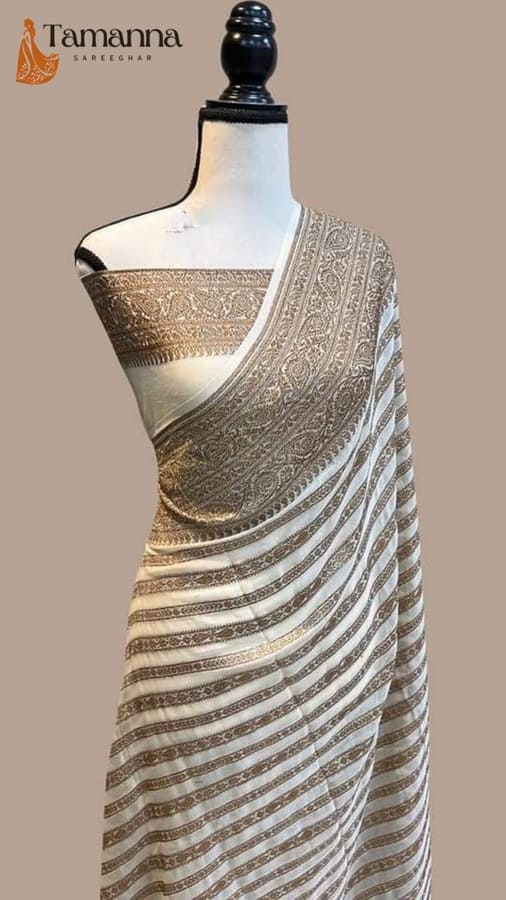 Off white silk banarasi saree with gold zari border and geometric paisley pallu