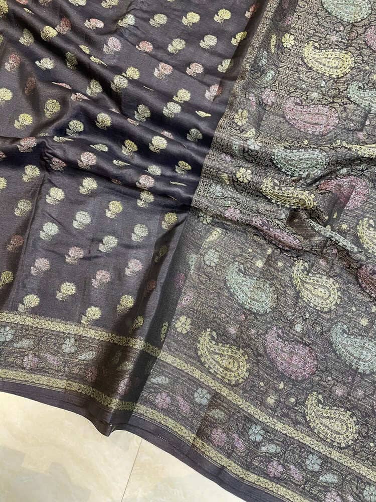 Banarasi saree fabric close-up in dark navy with scattered gold motifs and border