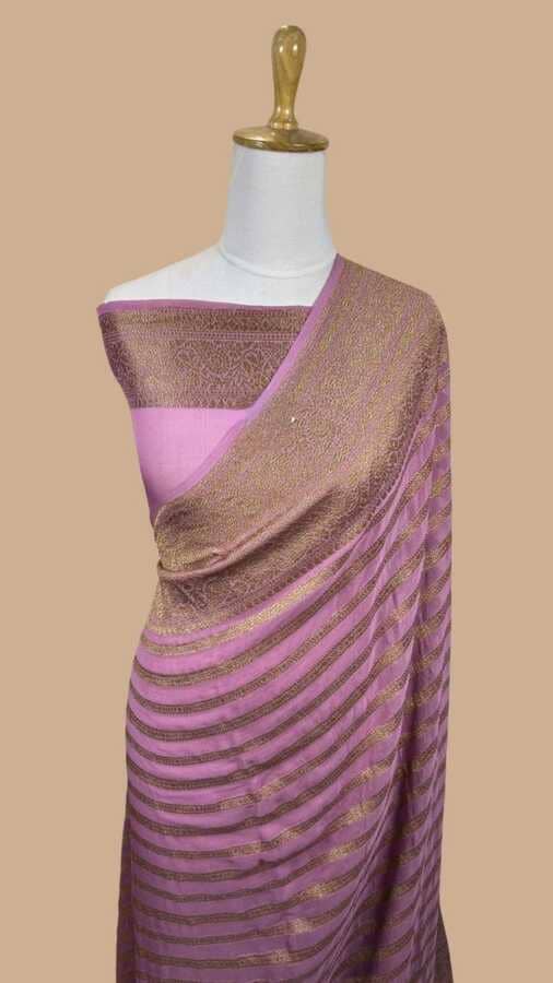 Lavender silk Banarasi saree with gold woven border and striped pallu drape