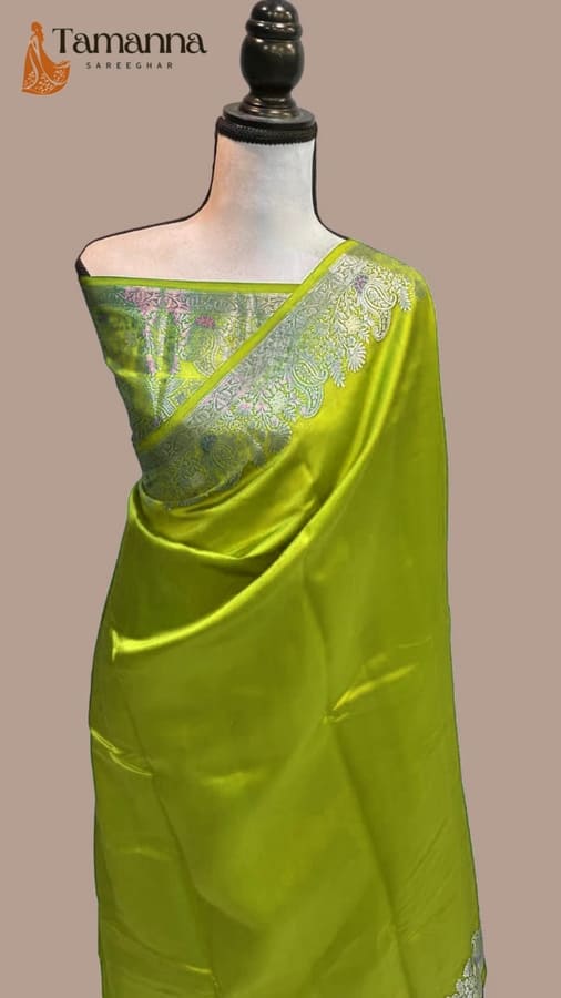 Lime green silk saree with grey zari border drape on mannequin