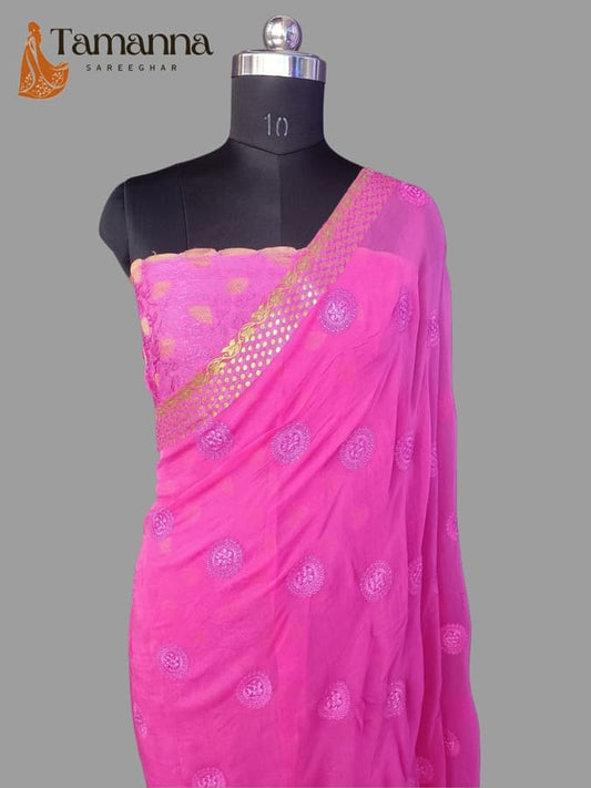 Pink chiffon saree with gold resham border and round motif detailing