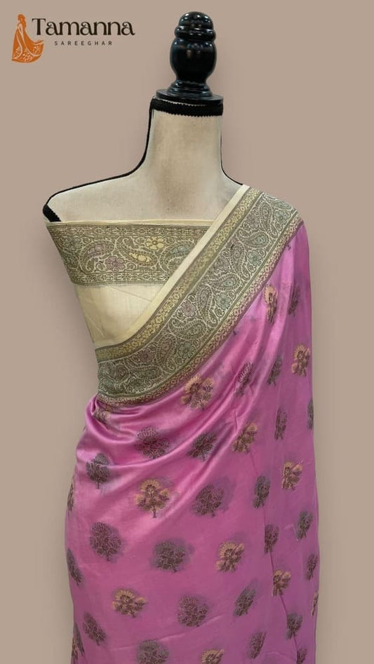 Pink crepe saree with gold zari border, floral motifs, and pallu drape